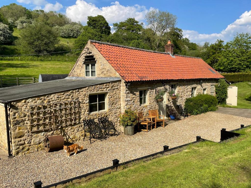 Mill Cottage with waterfall in North Yorkshire (Old Byland)