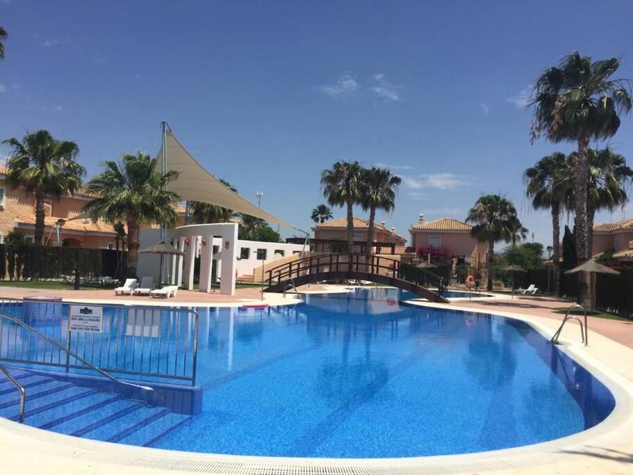 House sleeps 6, large pool walk to beach